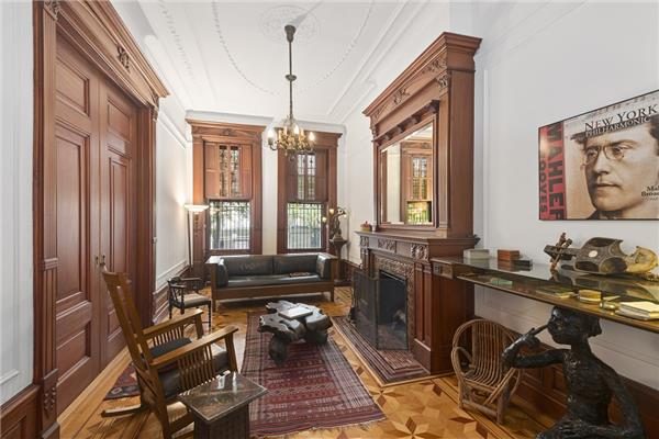 Nice front living room of the brownstone showing all the wood restaured and many moldes.