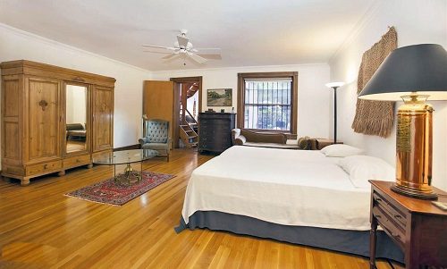 Large master bedroom showing the bed and closet.